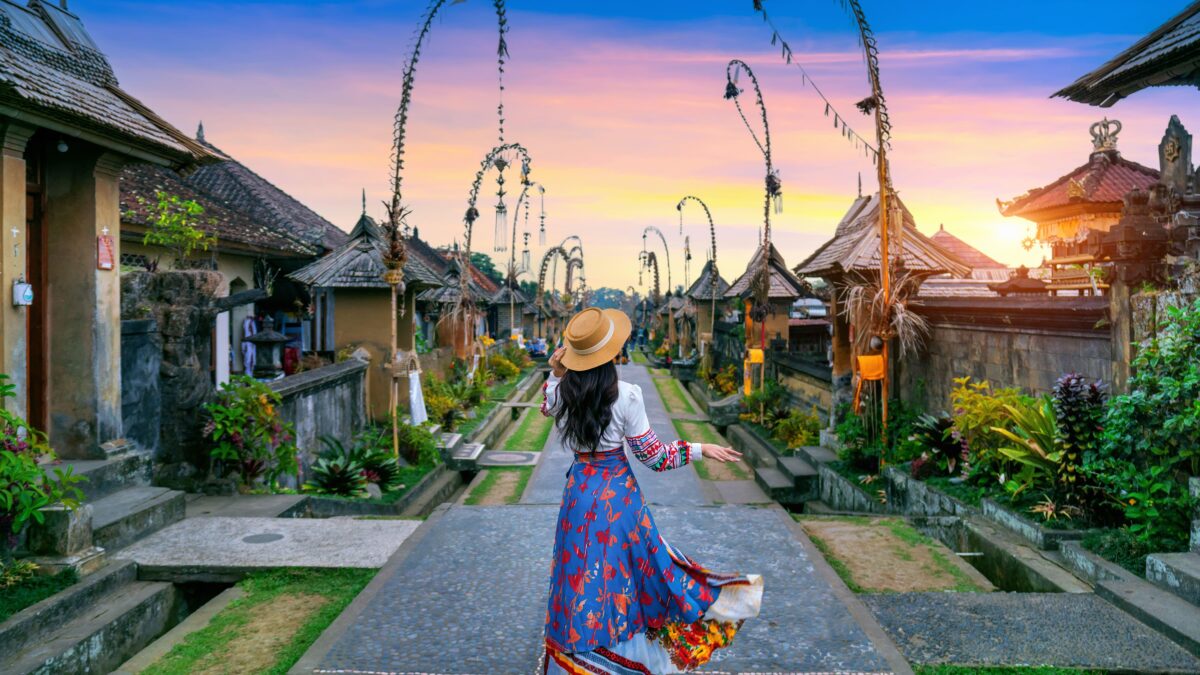 Girl walking in streets of Bali