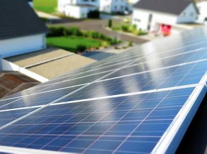 Solar panels installed on the roof of a residential house, harnessing renewable energy from the sun.